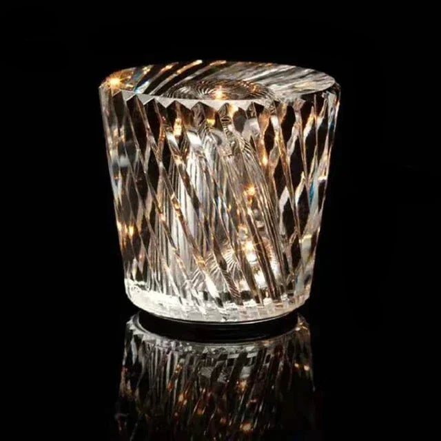 Decorative crystal table lamp glowing warmly in a cozy evening living room