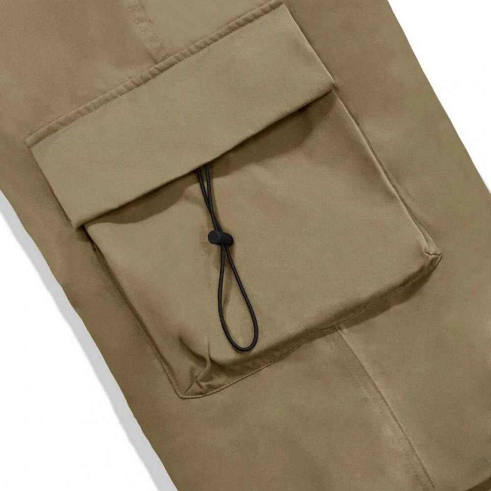 Close-up detail of cargo pocket with drawstring on trousers