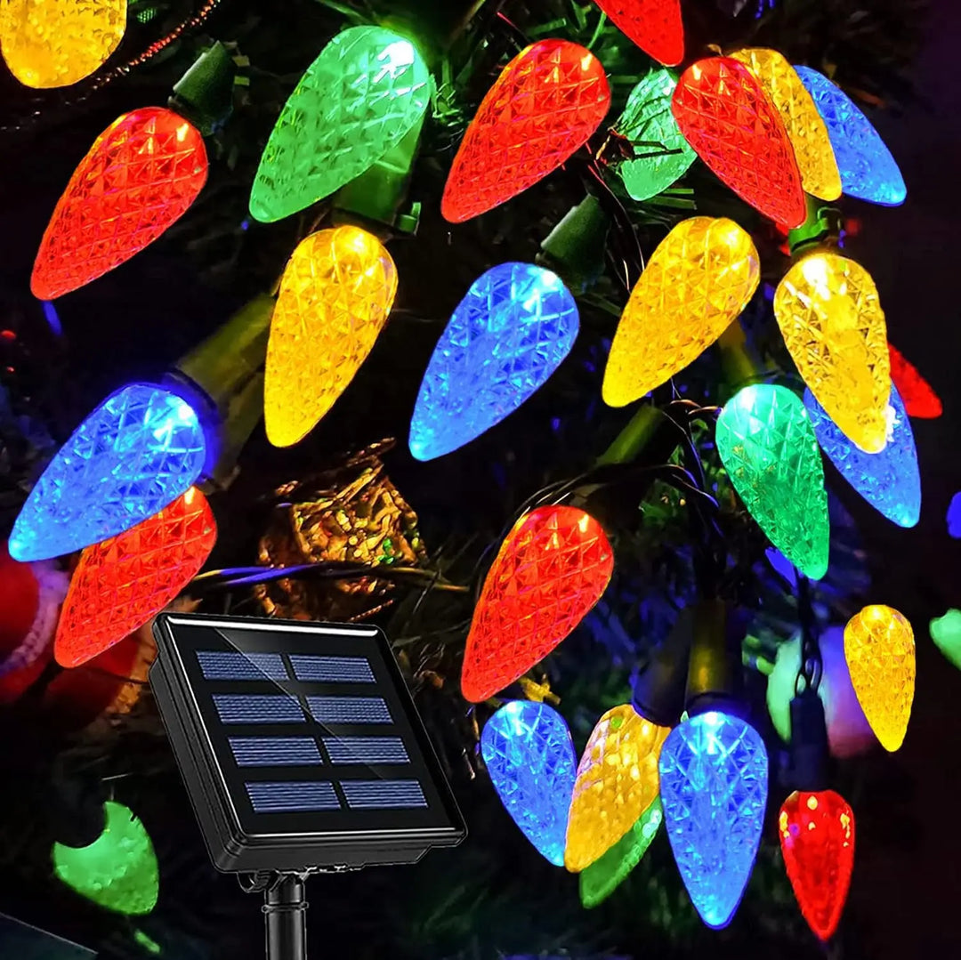 Close-up view of textured strawberry-shaped LED bulbs and solar panel
