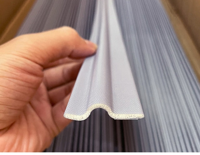 Waterproof draft seal strip protecting exterior threshold from rain