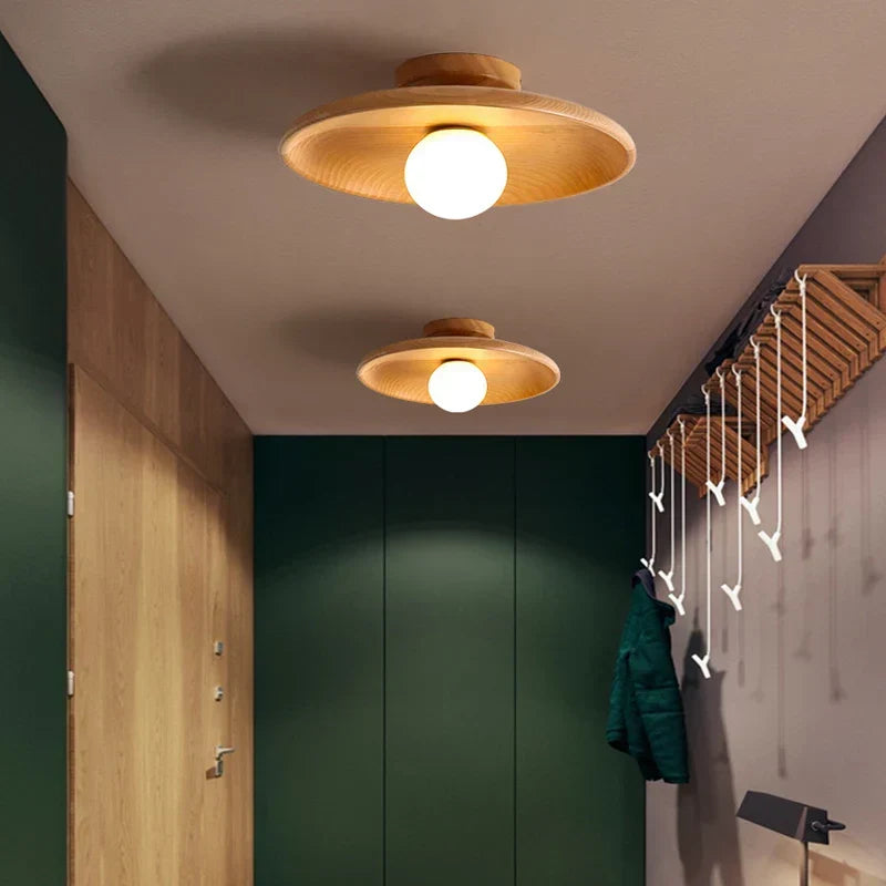 Woodland wooden ceiling lamp installed in a modern hallway with green walls