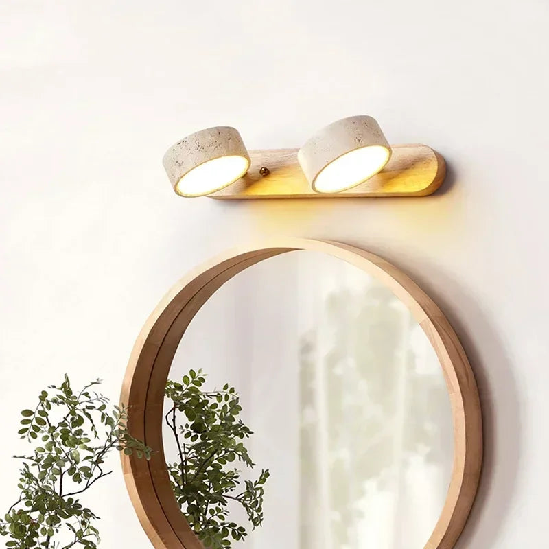 Modern LED wall lamp with rotatable stone shades mounted in a hallway