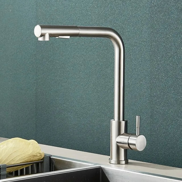 Brushed nickel pull-out kitchen faucet mounted on a countertop