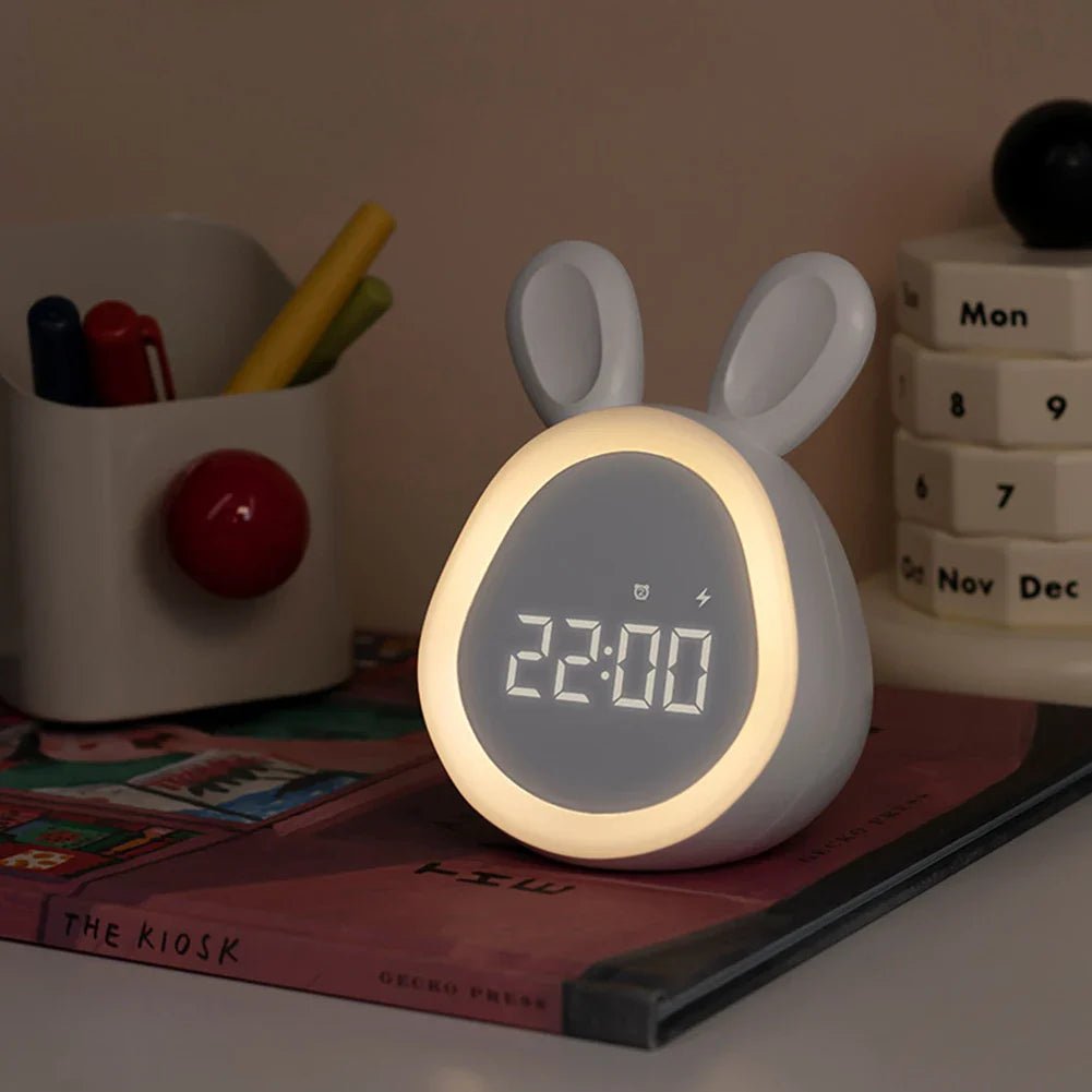 USB rechargeable kids alarm clock featuring a cute rabbit design in white