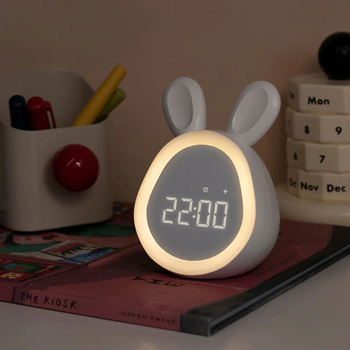 USB rechargeable kids alarm clock featuring a cute rabbit design in white
