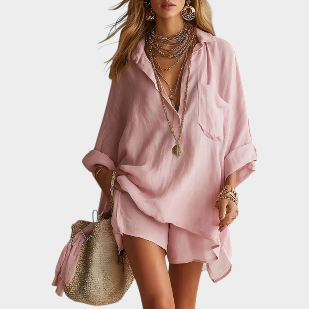 Woman wearing pink oversized button-down shirt and matching shorts set