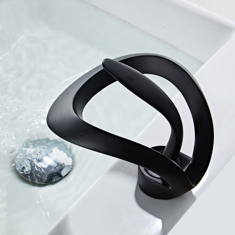 Modern waterfall bathroom tap angled view showing single handle and spout