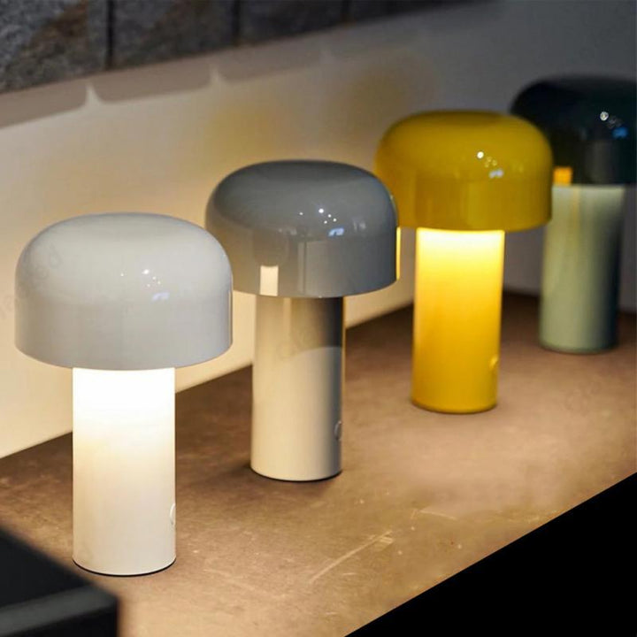 Cordless retro desk lamp casting warm mood lighting on a surface