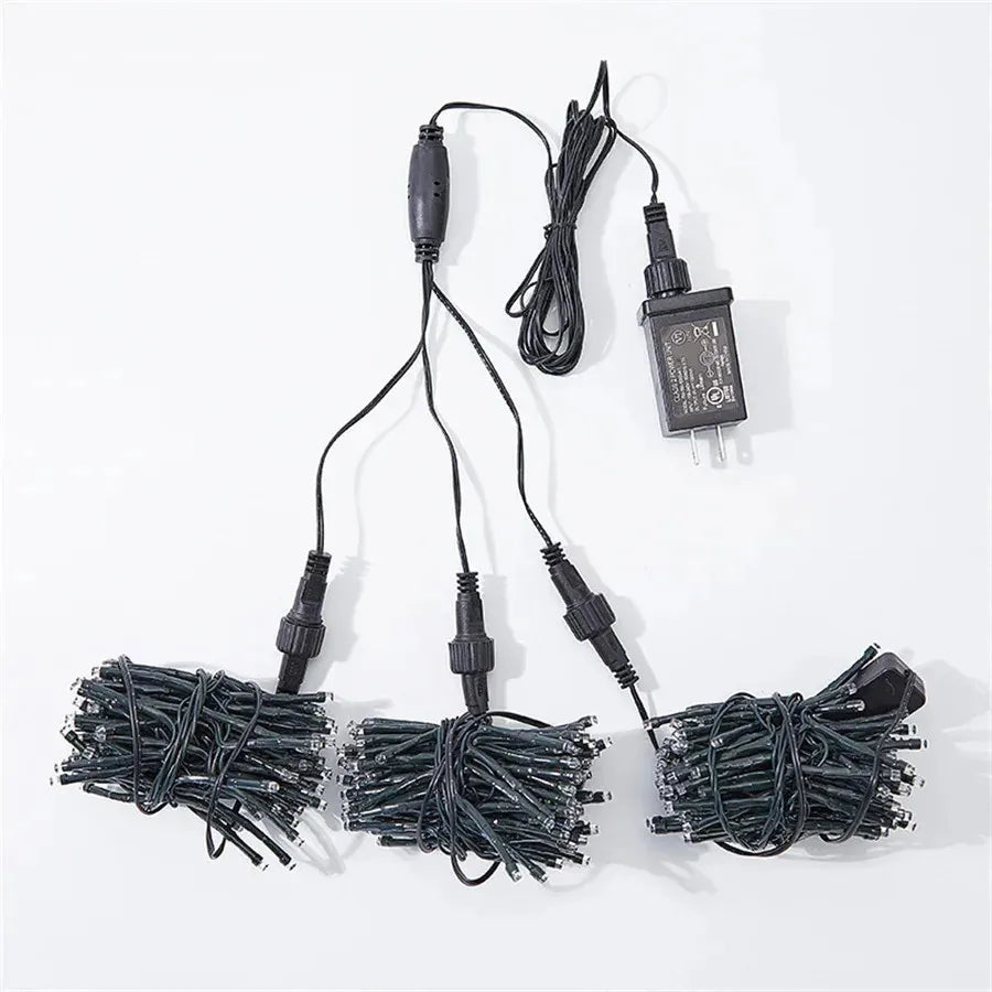 Long string of outdoor meteor shower lights displayed on a dark background showcasing bulb spacing