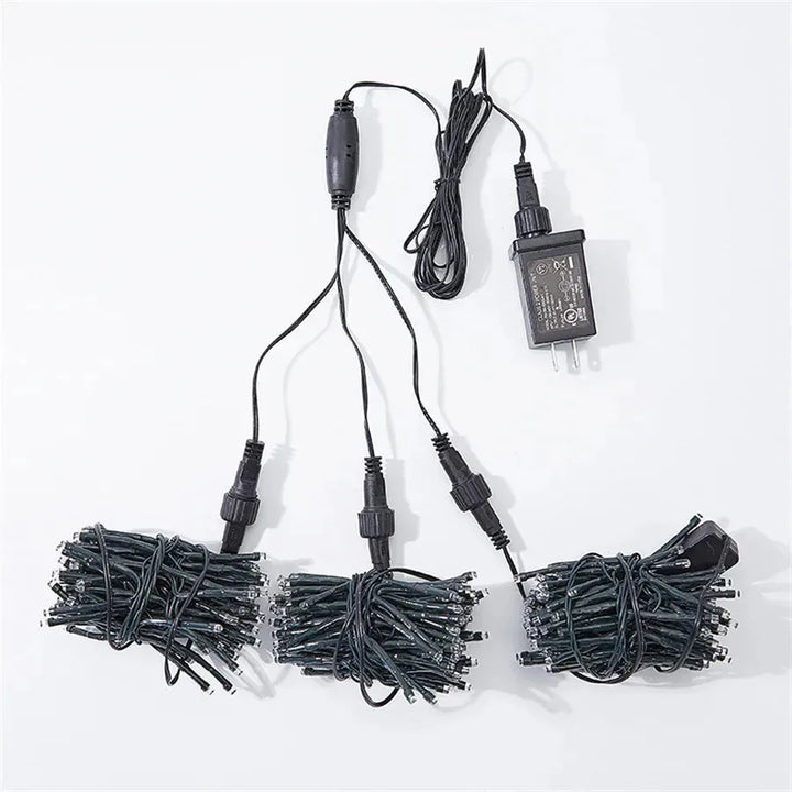 Long string of outdoor meteor shower lights displayed on a dark background showcasing bulb spacing