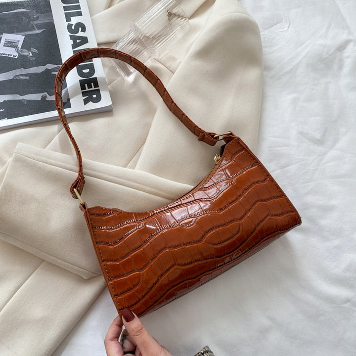 Gift-ready women's handbag packaged elegantly with dust bag and tags