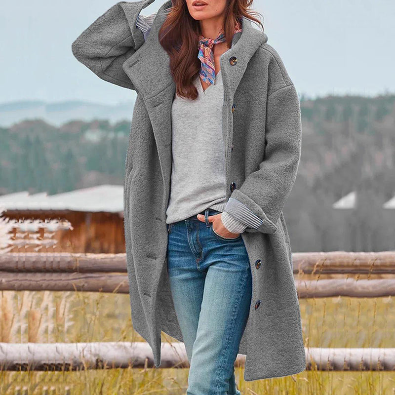 Woman wearing the grey Evelyn winter coat outdoors