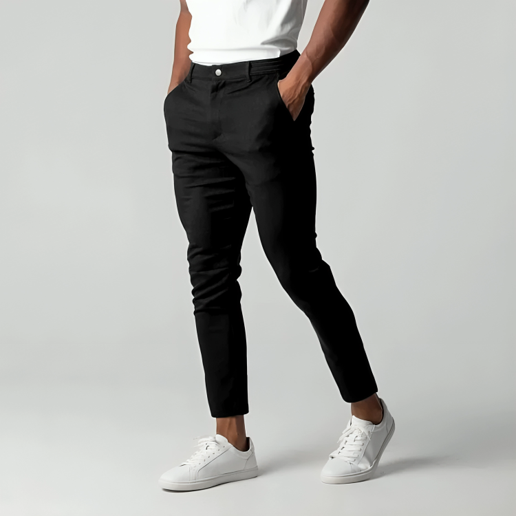 Man wearing black slim fit flex chino trousers with white sneakers