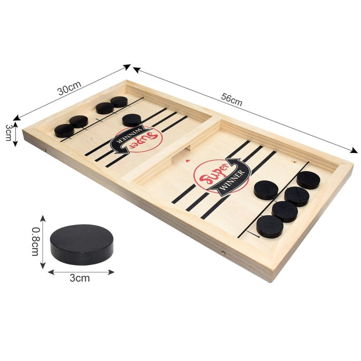 Close up of wooden game pieces on a tabletop hockey party game for kids