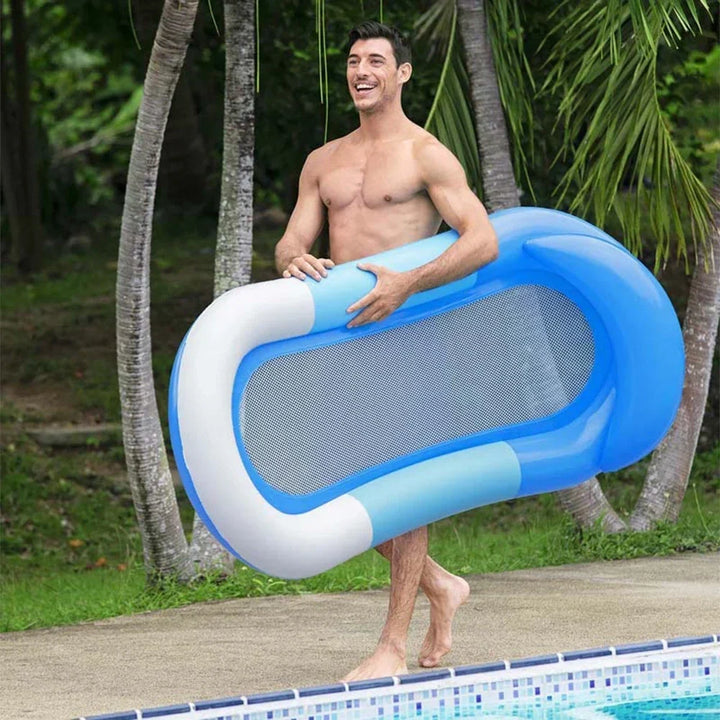 Water hammock pool float being used as a relaxing pool lounger in blue water