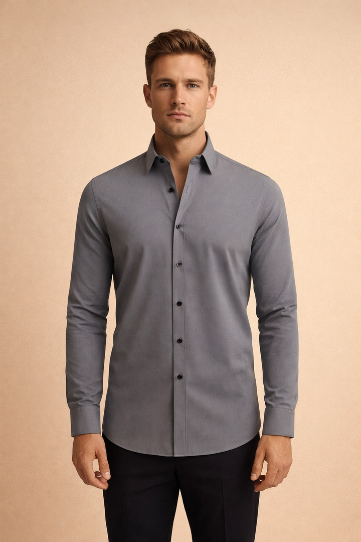 Man wearing a gray long-sleeve button-down shirt with a tailored fit and dark buttons.