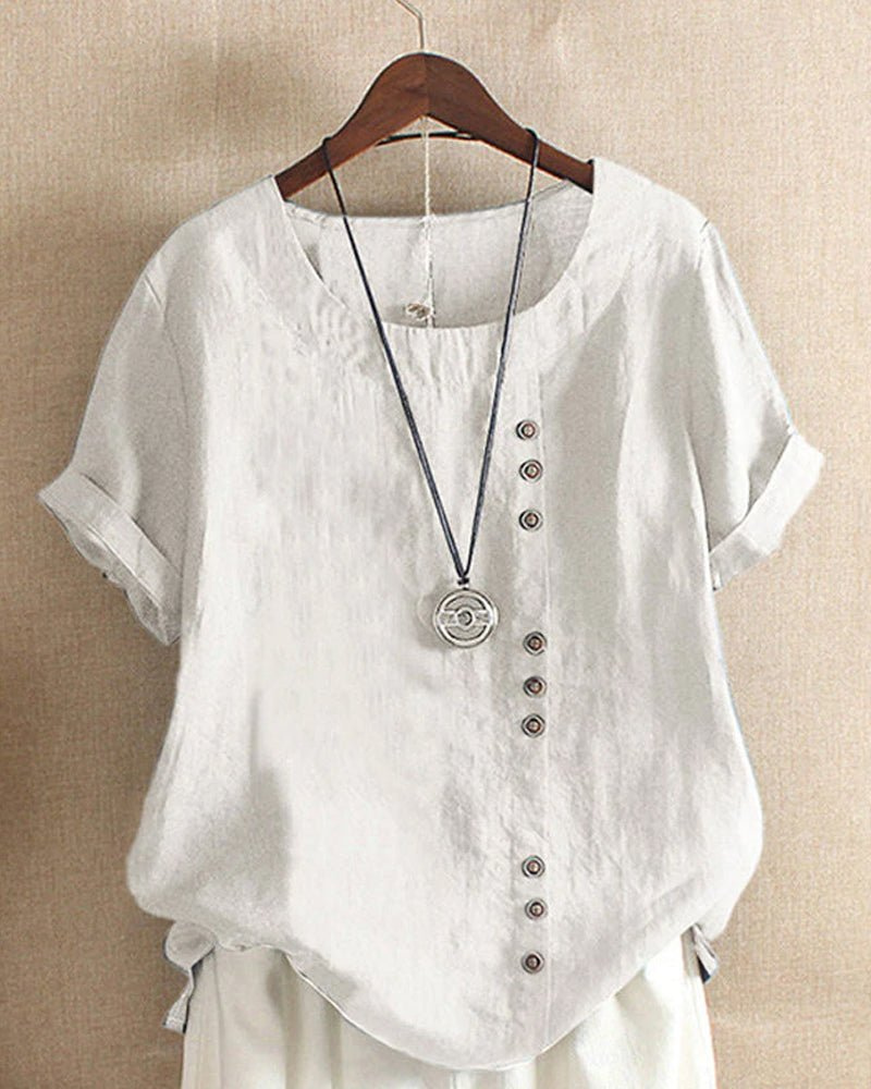 Women's casual white short sleeve blouse with decorative buttons on a hanger