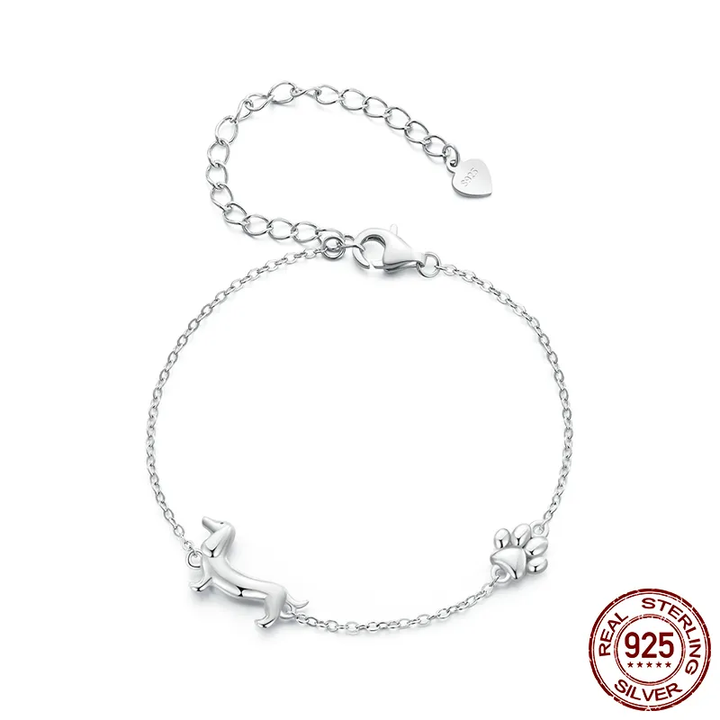 Sterling silver dachshund charm bracelet on a wrist as a dog lover gift