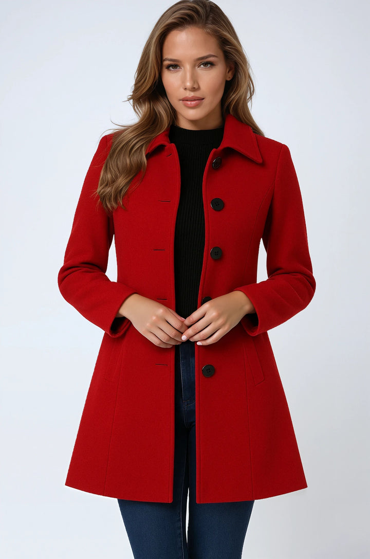 Model wearing a red single-breasted trench coat with black sweater