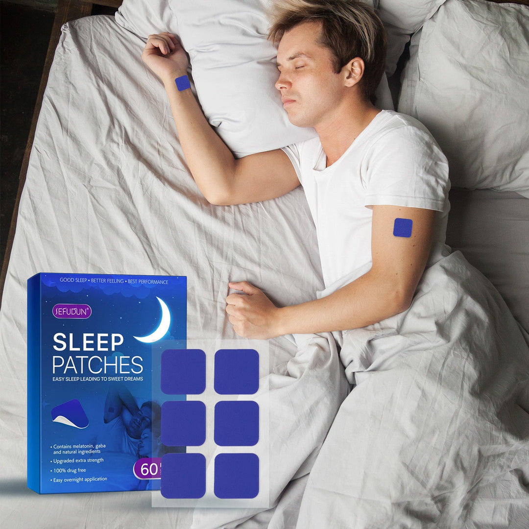 Man resting comfortably in bed wearing a sleep patch on his arm