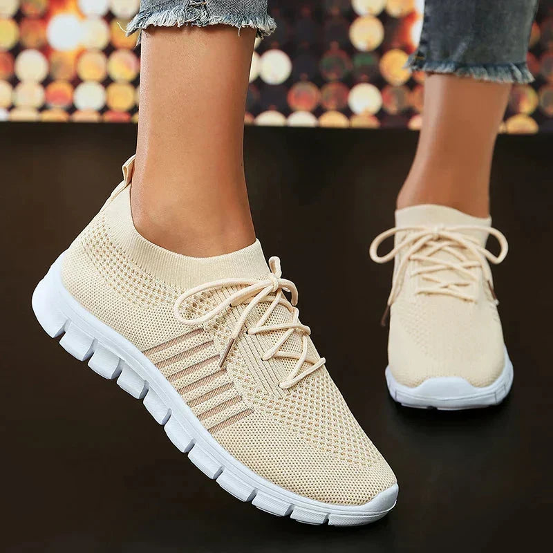 Beige women's mesh walking sneakers styled for everyday casual wear