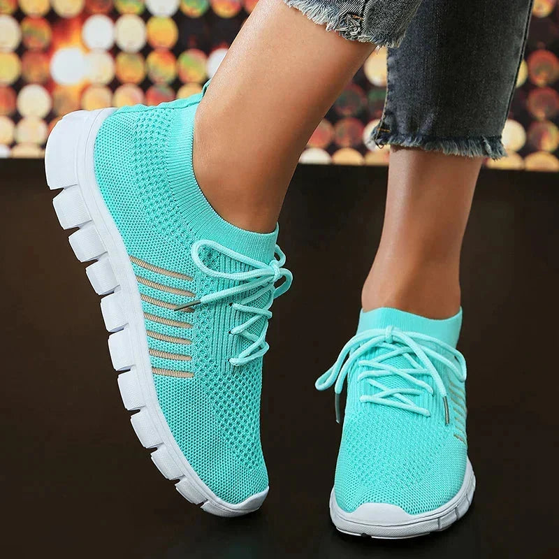 Women's orthopedic walking sneakers showing cushioned sole and breathable mesh