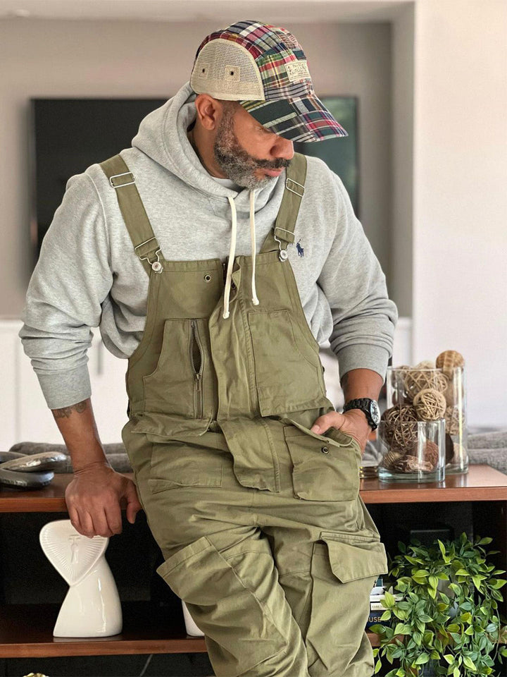 Side profile of cargo overalls for men showing relaxed utility fit