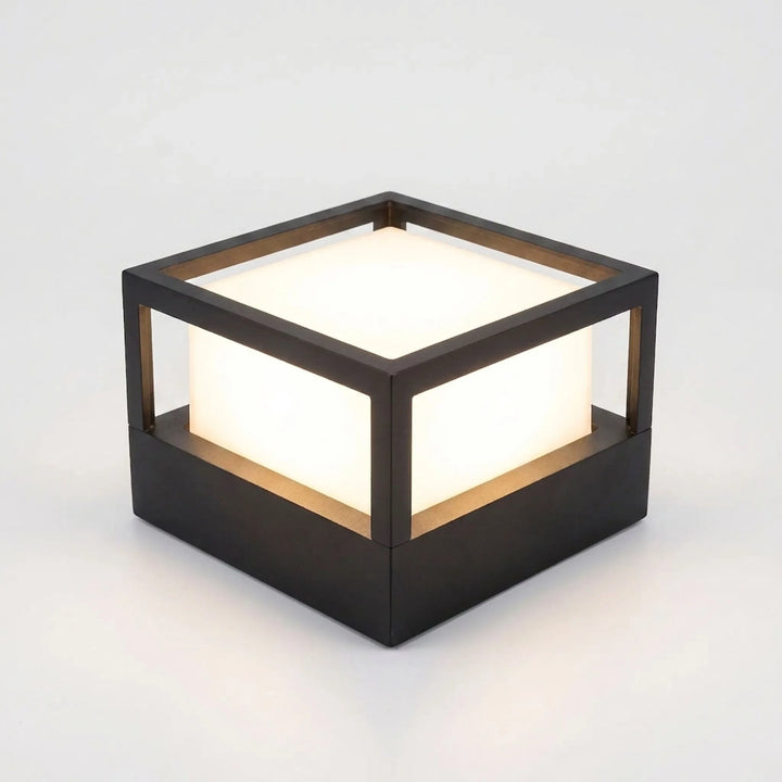 Smart LED wall light Vesperon glowing on exterior home wall at night