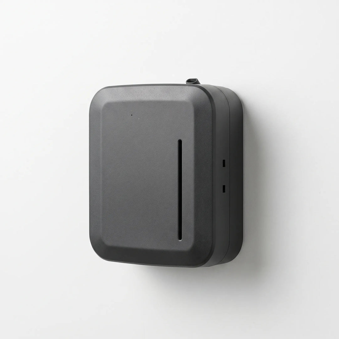 Studio shot of the black smart aroma oil diffuser mounted against a clean white background