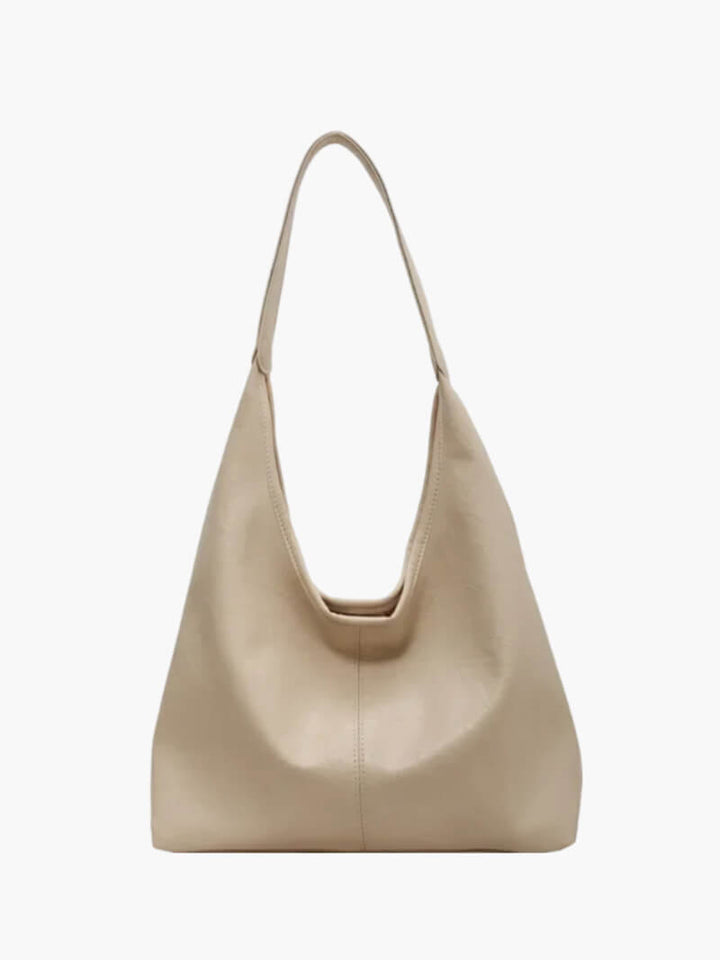 Beige women's minimalist shoulder bag front view on white background