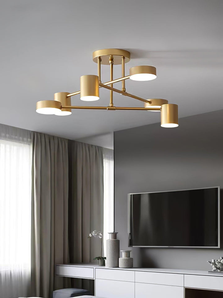 Elegant modern gold ceiling light illuminating a stylish apartment interior