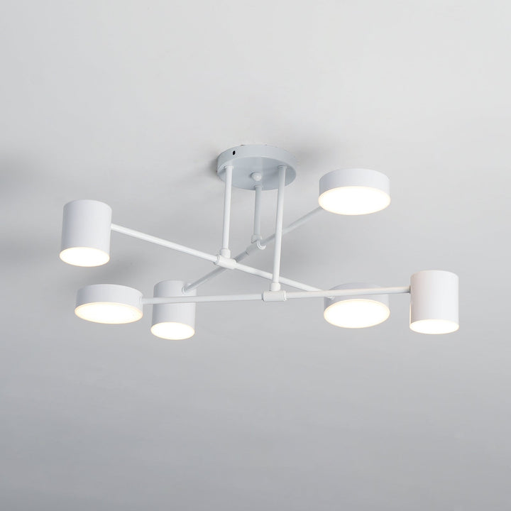 Architectural shot of the modern metal chandelier illuminating a hallway