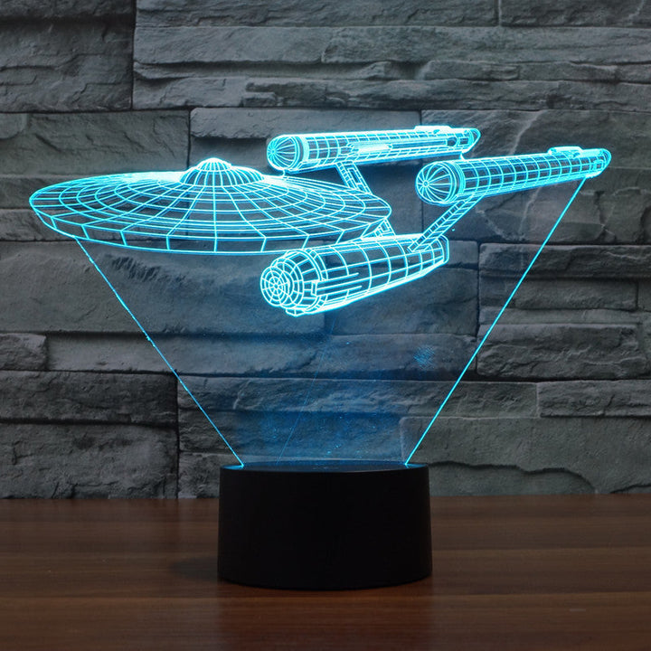 Side view of the floating starship optical illusion lamp with blue illumination