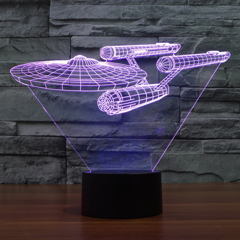 Starship 3D illusion lamp glowing with purple and magenta multicolored LED light