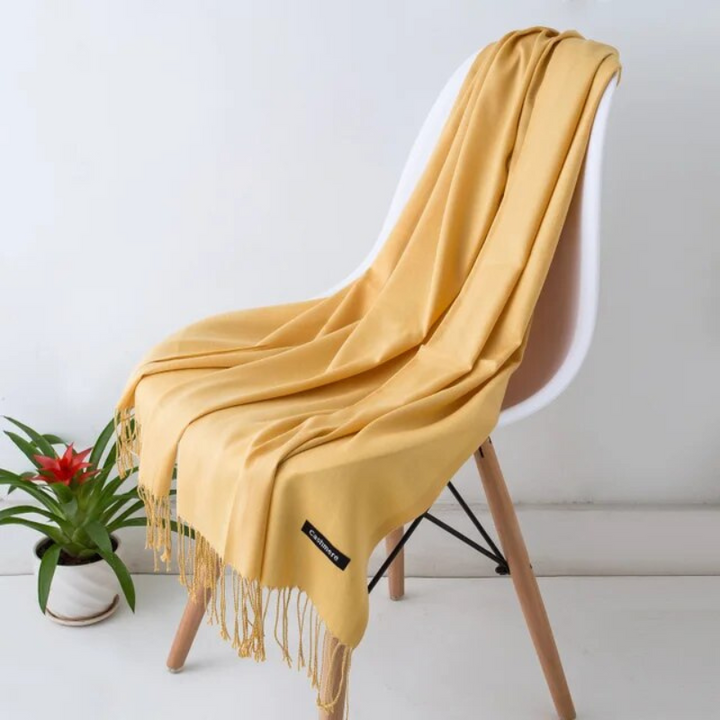 Folded women's scarf highlighting its rich color and thick material