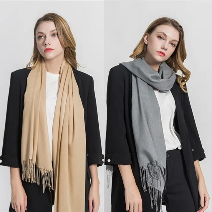 Women modeling beige and gray winter scarves