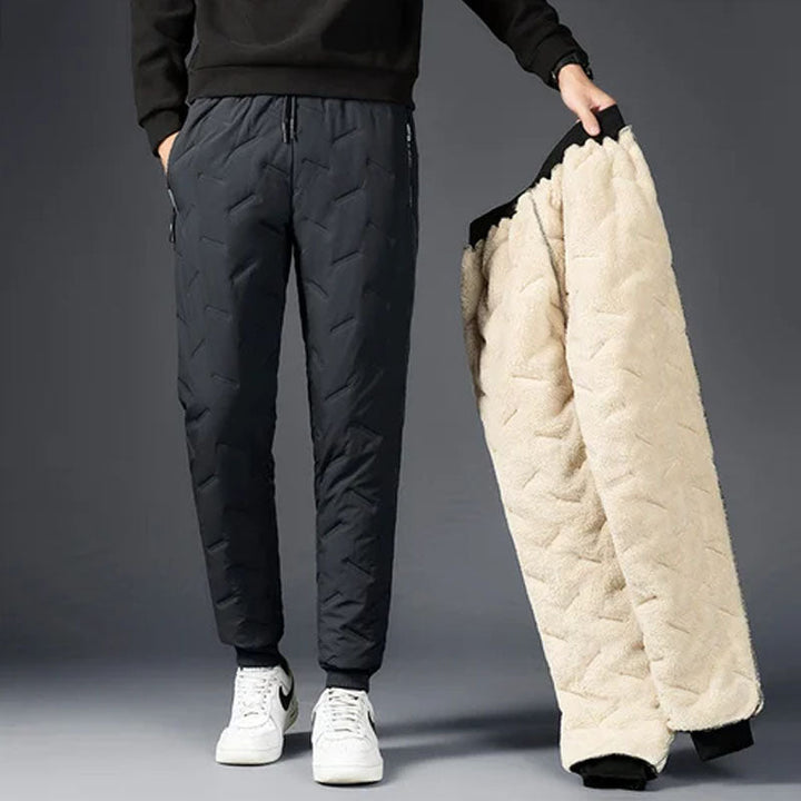 Men's waterproof thermal fleece winter pants in solid black, front view
