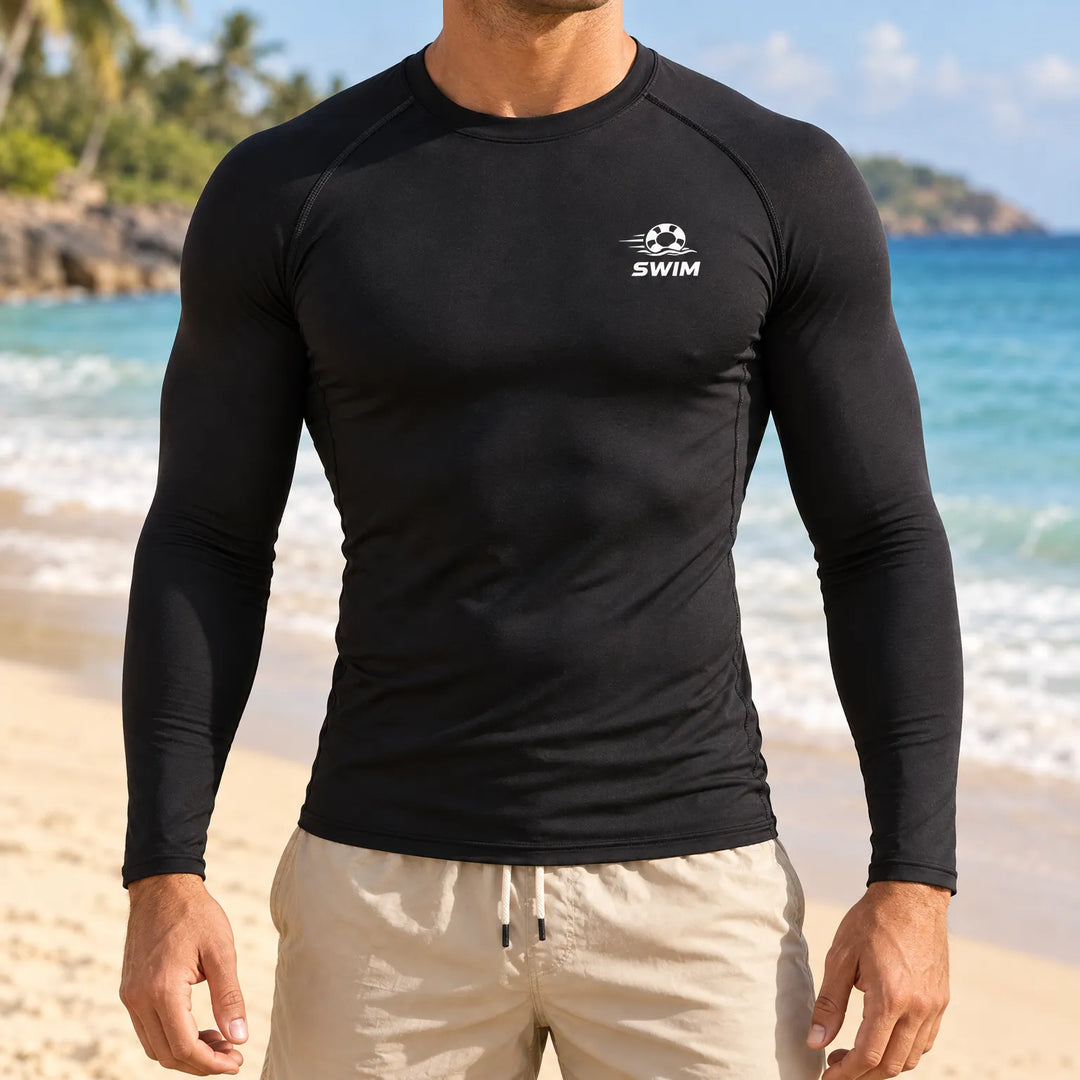 Man wearing black long sleeve rash guard swim shirt on beach