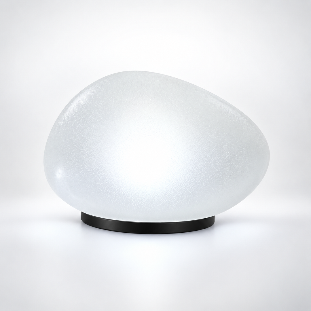 Close-up studio shot of a single frosted pebble solar light with a clean black base