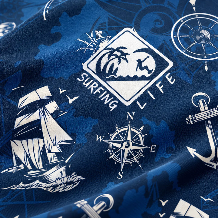 Folded mens long sleeve surf shirt ready for travel and beach
