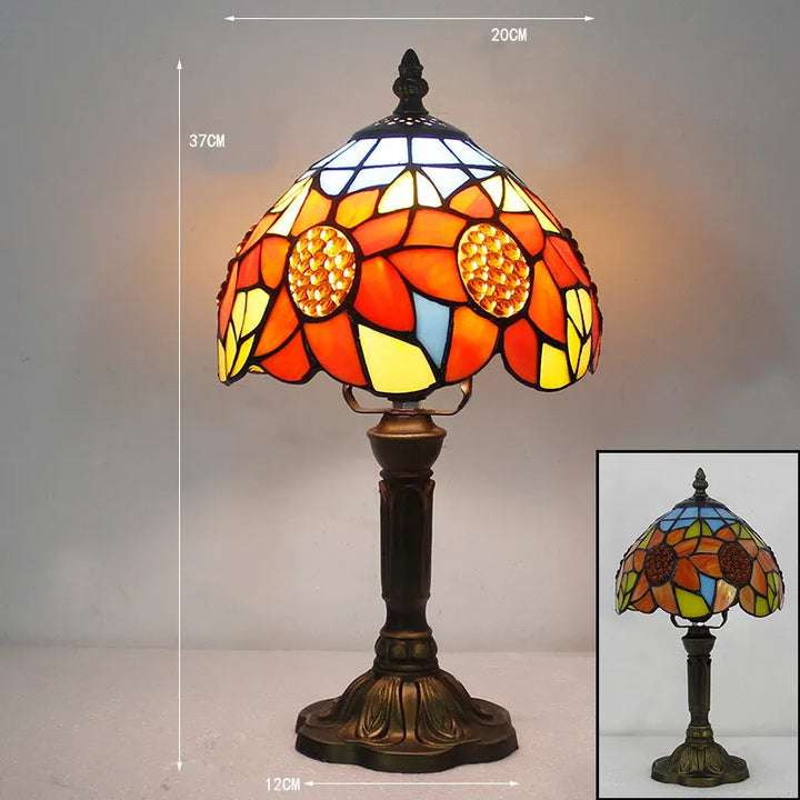 Tiffany stained glass table lamp casting colorful light on a desk