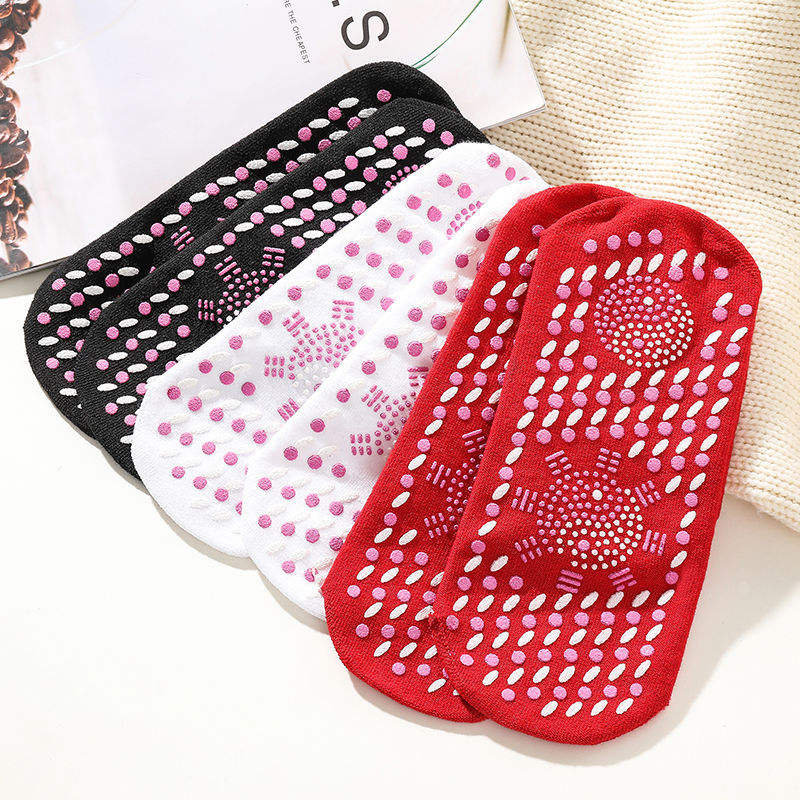 Stacked pair of red, white, and black thermal grip socks