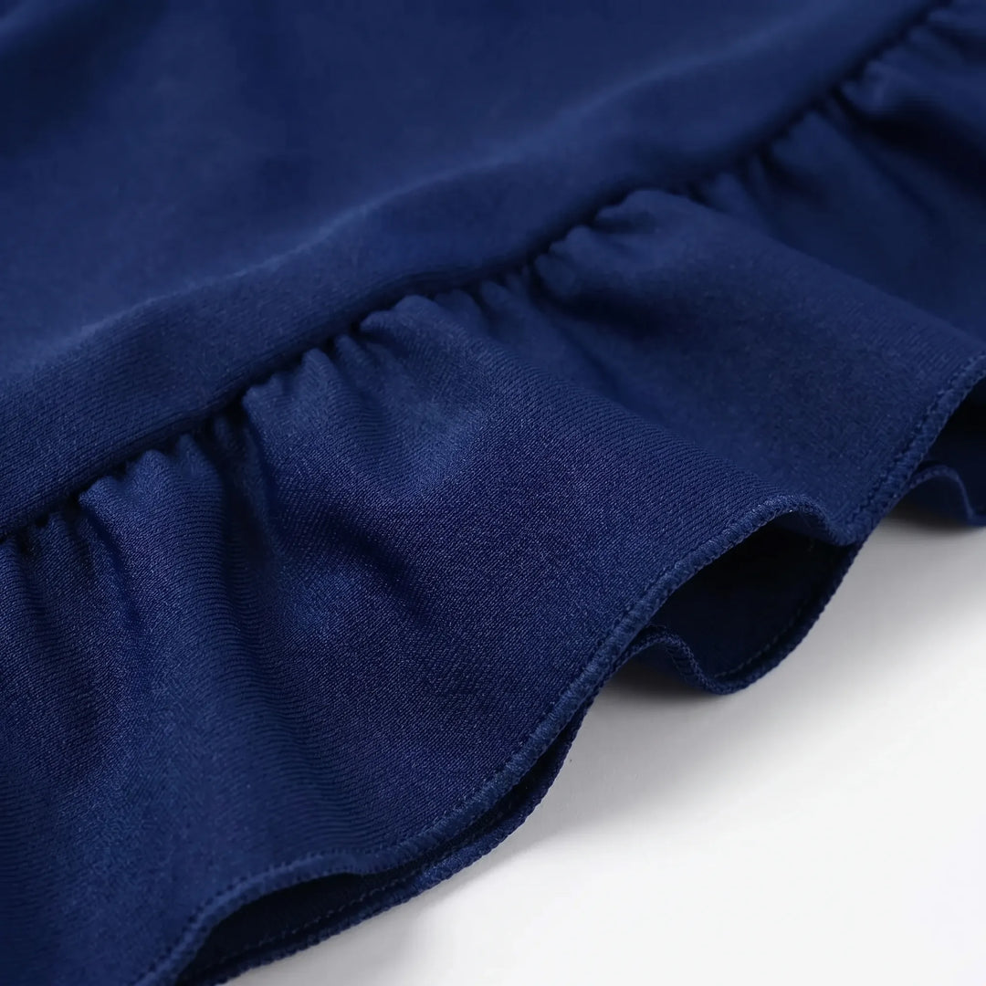 Close-up of the ruffled textured fabric on the blue swim set