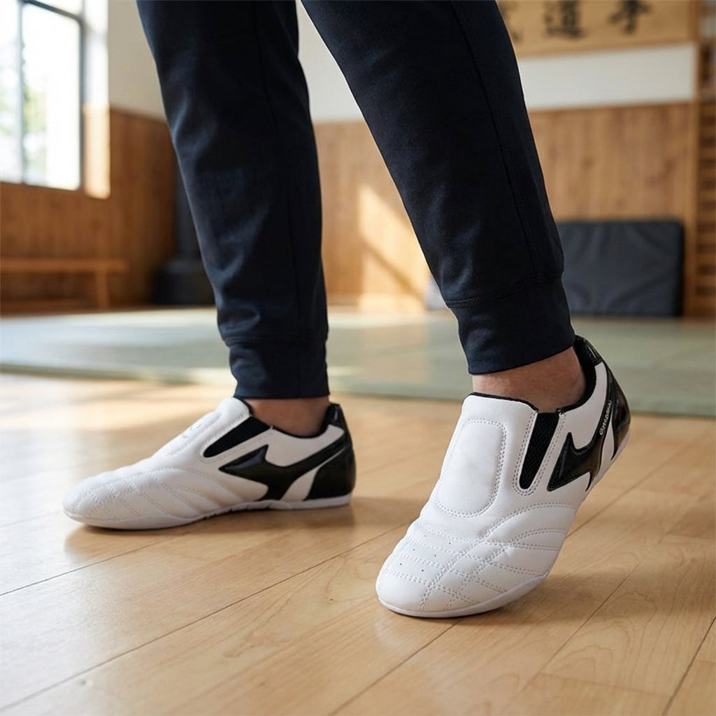 Close-up of white combat sports shoes worn during martial arts training