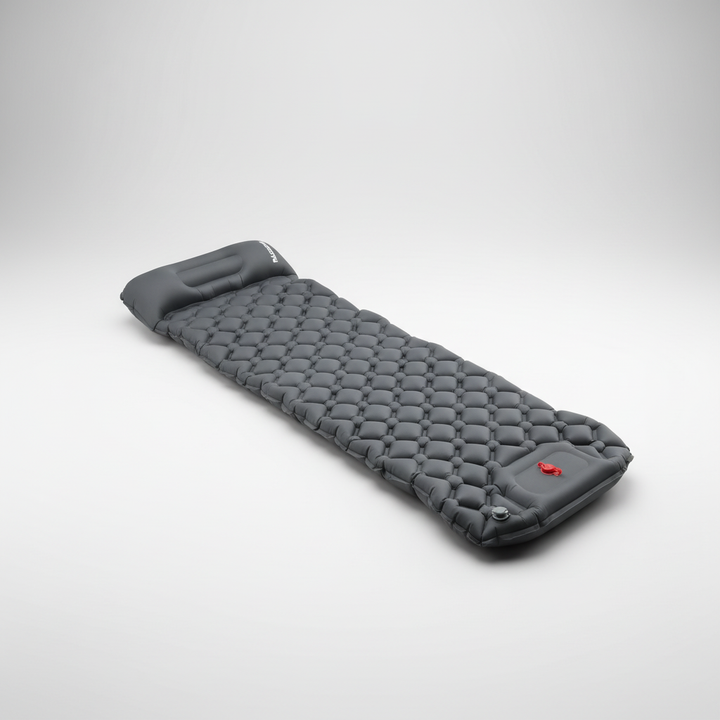 Studio view of the grey inflatable sleeping mat with integrated pillow and foot pump valve