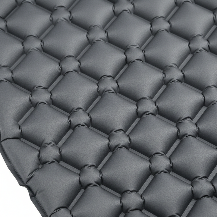 Close-up detail of the contoured supportive air cell pattern on the sleeping mat