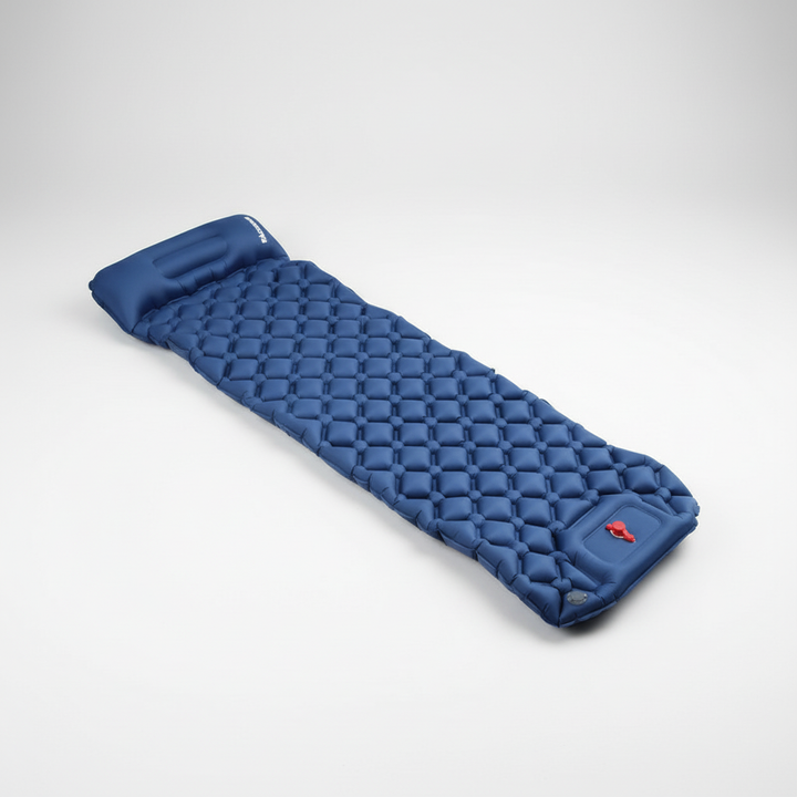 Compact hiking mattress folded and packed next to the sleeping gear