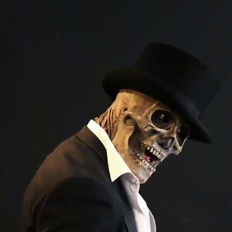 Close-up of scary skull mask and costume hat for Halloween party disguise
