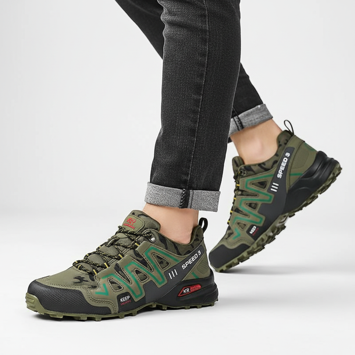 Side profile of green unisex waterproof hiking shoes on outdoor terrain