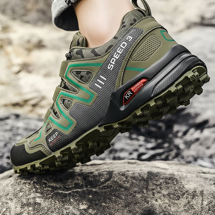 Close-up of the non-slip rubber outsole and tread pattern on green hiking shoe